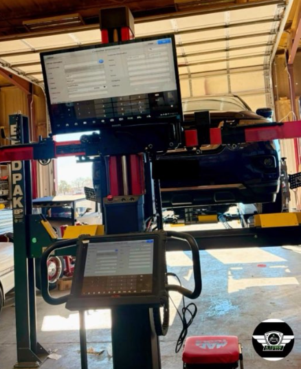 Computerized alignment rack with a truck on the lift